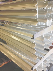 white powder coated angle brackets on rack